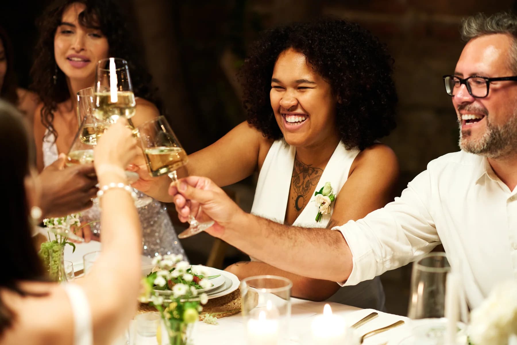 Guests gathered around a table, conversation and celebration
